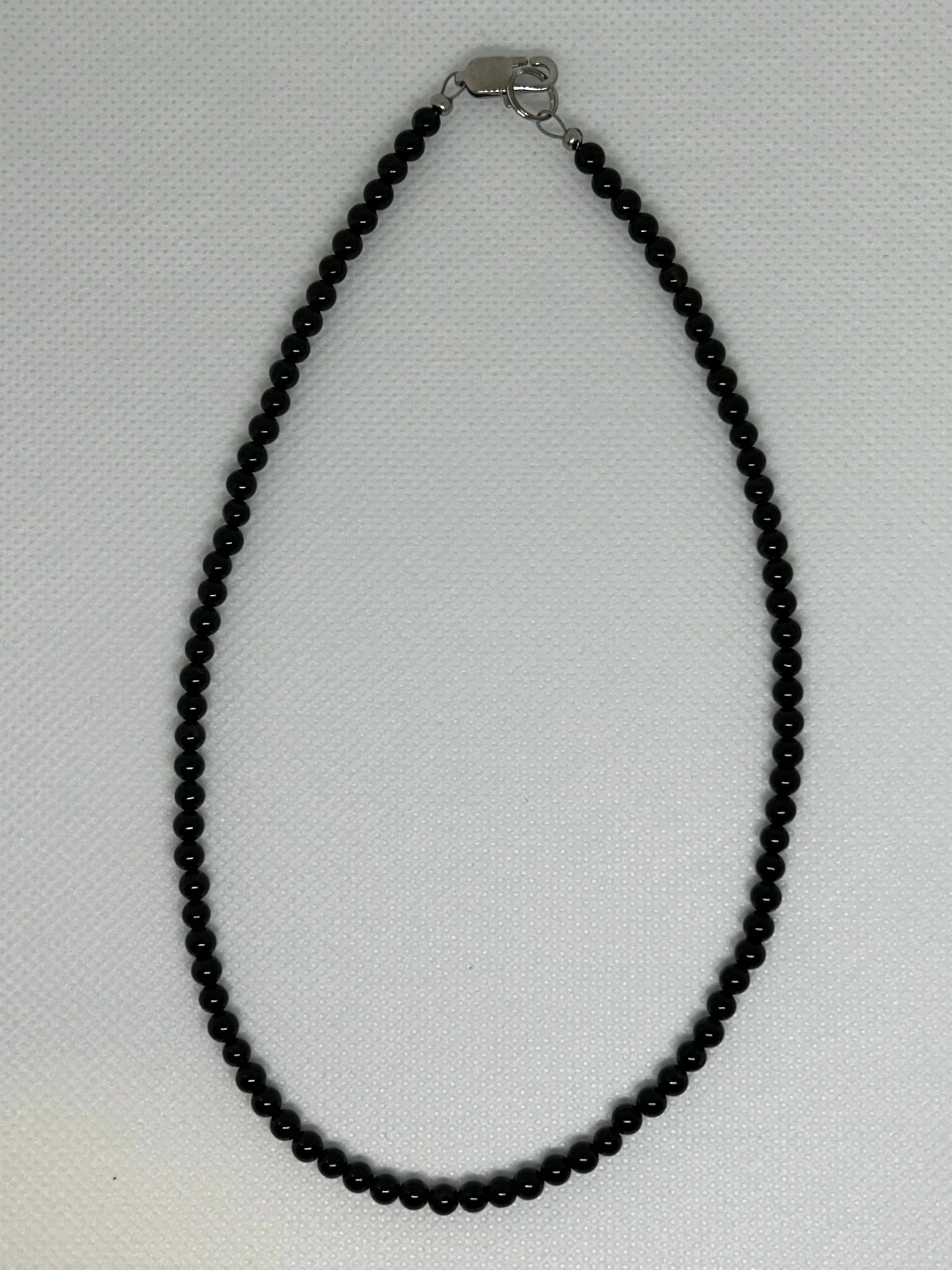 Genuine Black Onyx stone necklace with hypoallergenic stainless steel clasp.  15”. EP122